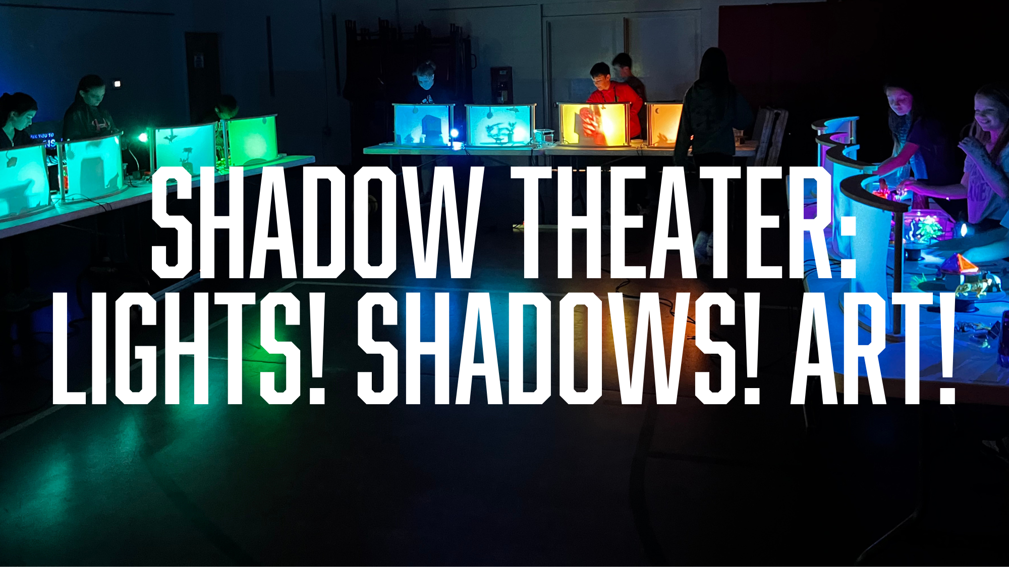Students gather behind shadow screens while stacking plastic animals and props to create a shadowed backlit scene.