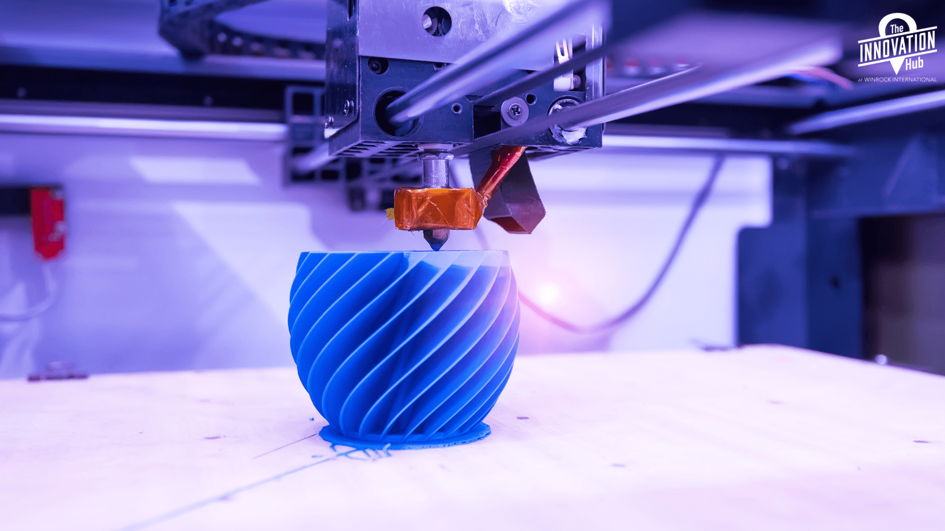 A swirly vase, being printed on a 3D printer