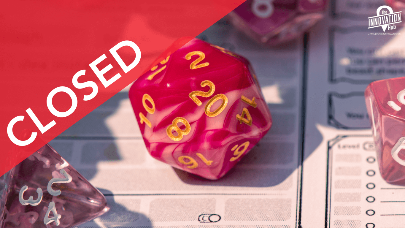 pink dice of varying sizes rest on top of a Dungeons and Dragons character sheet.