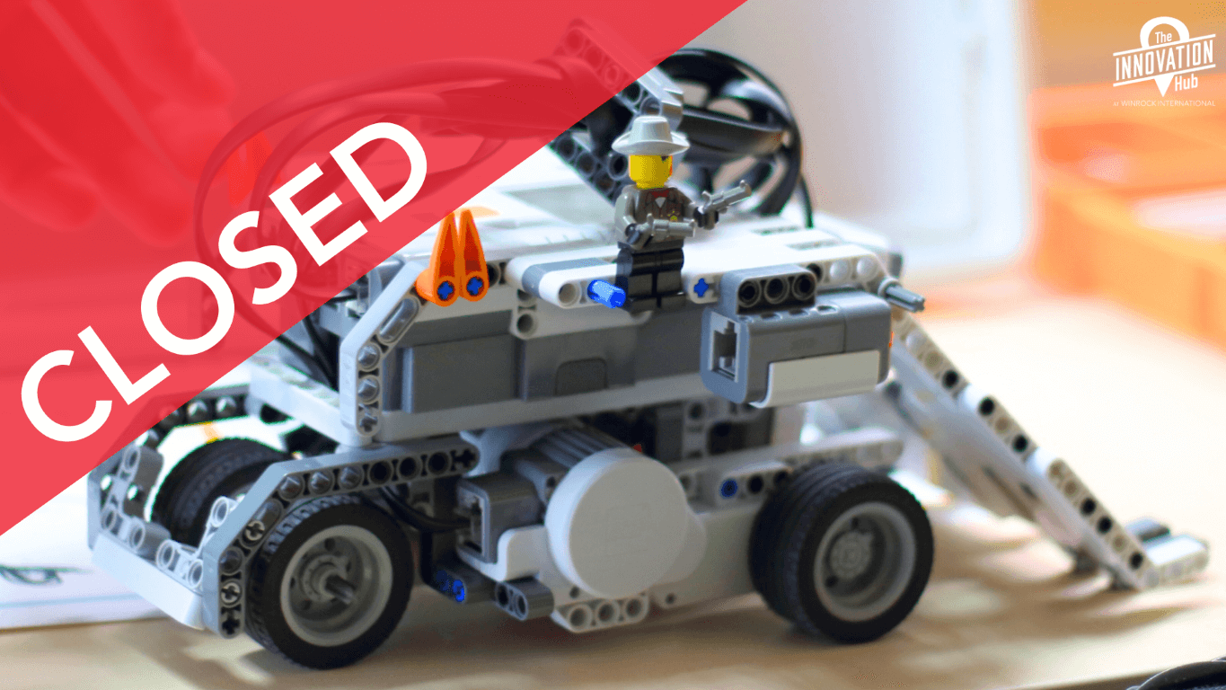 a photo of a completed lego spike battle robot tank with a cowboy lego on top.